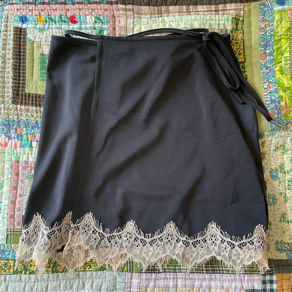 Black satin skirt with lace trim